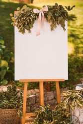 White decorated board for the guest list