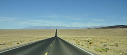 Highway through Death Valley National Park in California / Lonesome Highway