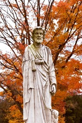 Fall scene of a religious figure statue
