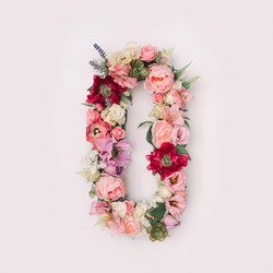 Letter O or number 0 made of real natural flowers and leaves. Flower font concept. Unique collection of letters and numbers. Spring, summer and valentines creative idea.