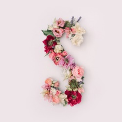 Letter S made of real natural flowers and leaves. Flower font concept. Unique collection of letters and numbers. Spring, summer and valentines creative idea.