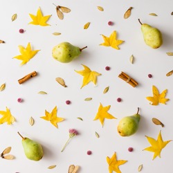 Colorful autumn pattern made of pears, leaves and flowers.  Flat lay. Fall concept