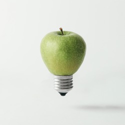 Apple lightbulb on bright background. Idea concept.