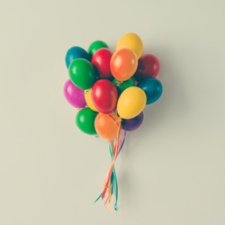Colorful bunch of Easter egg balloons on bright white background. Minimal creative concept. Flat lay.
