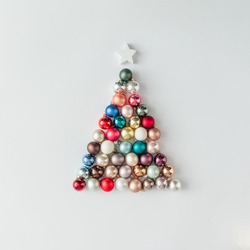 Christmas tree made of bauble decoration. Minimal New year concept.