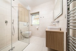 new, modern bathroom with shower in the apartment