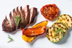 Barbecue dish. Beef steak and grilled vegetables top view.