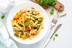 Vegan pasta fusilli with vegetables, zucchini, paprika and grean beans.