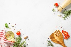 Food background with spices, herbs and utensil on white background.