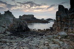 dramatic rocky coastline at dusk, ouessant island, brittany, france