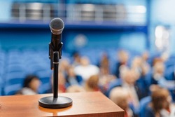 Close-up shot of a microphone at the conference hall