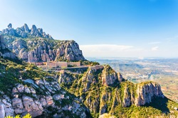 View of the Monastery of Montserrat in Catalonia, near Barcelona. Panorama from the top of the mountain.