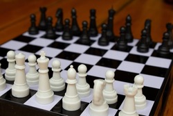 Chess pawns against pawns. The concept of confrontation. Start of the competition. Pawns in a row against each other.
