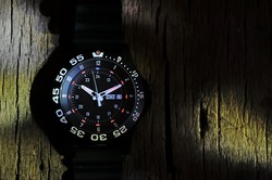 Tritium military watch on old wood 