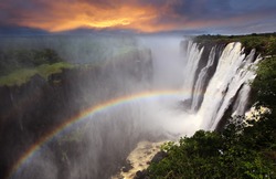 Victoria Falls sunset with rainbow, Zambia