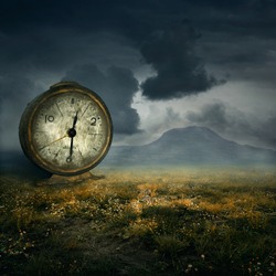 Old table clock in fantasy atmosphere