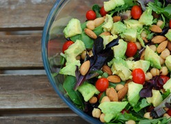 Mixed green salad with vegetables and nuts