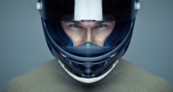 Handsome man in helmet on blue background