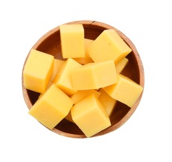 Cubes of cheddar cheese isolated in wooden bowl on white 