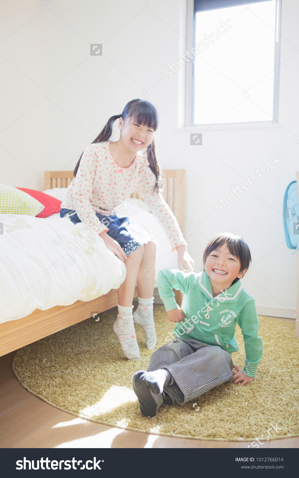 Japanese Sisters Using Younger Brother