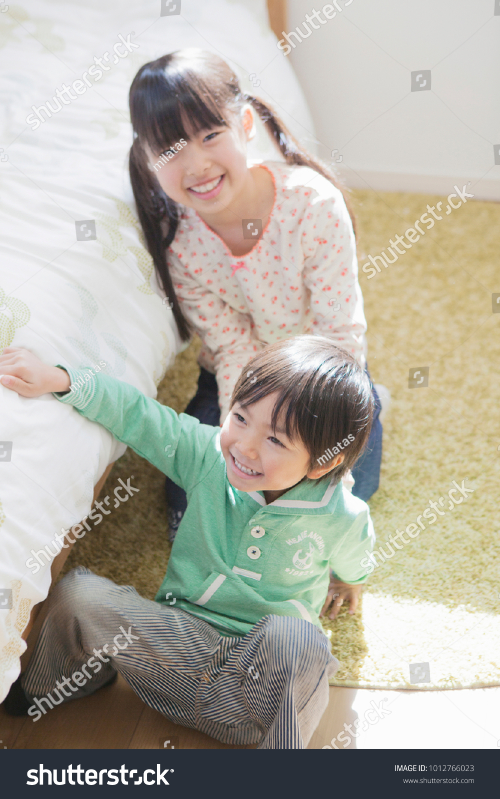 Japanese Sisters Using Younger Brother