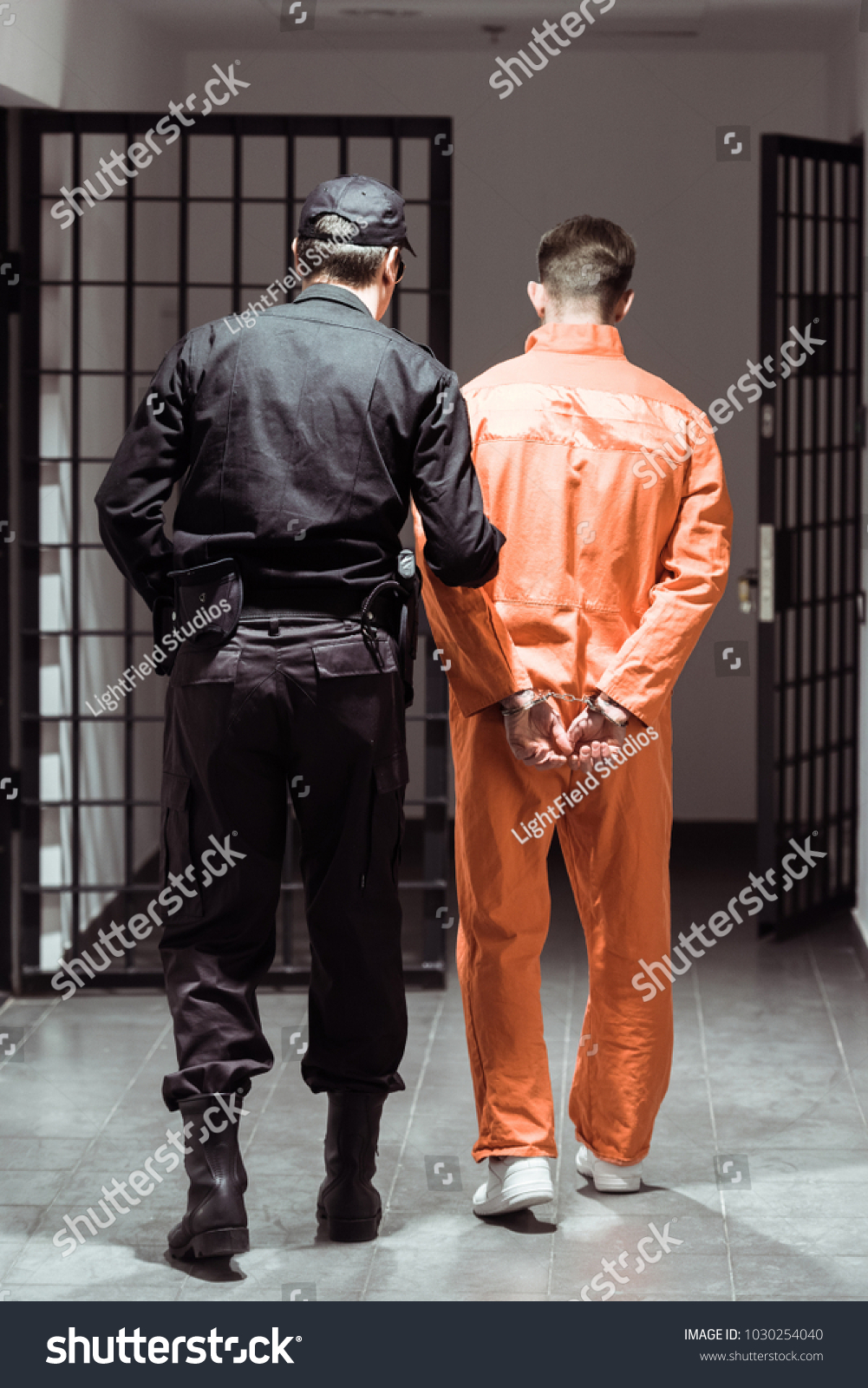 Back View Prison Officer Leading Prisoner Stock Photo 1030254040 ...