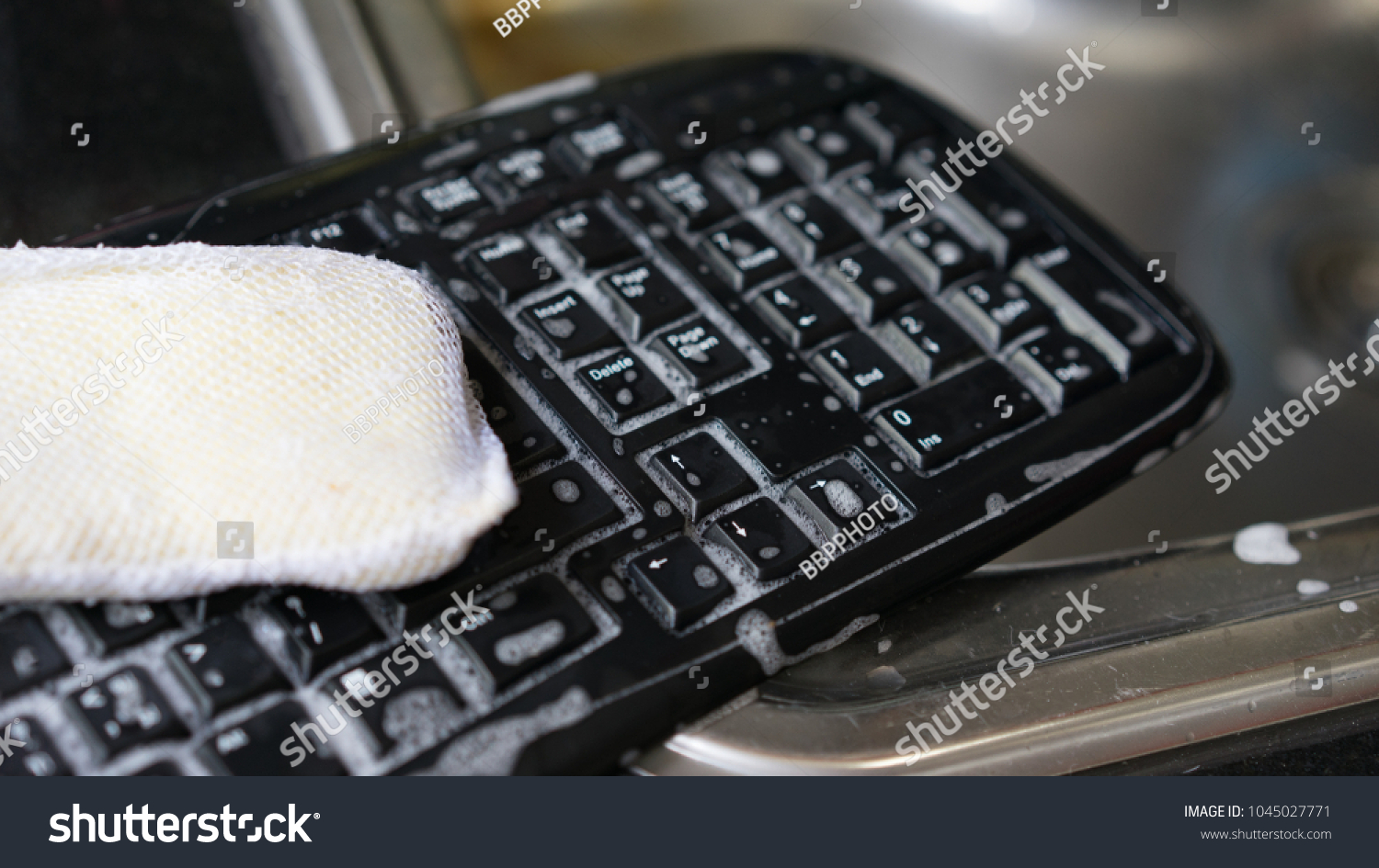 clean keyboard with water