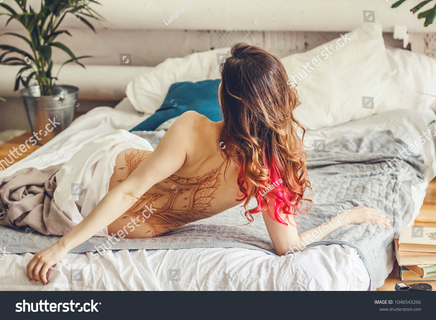 Nude Young Woman Sleeping On Bed Stock