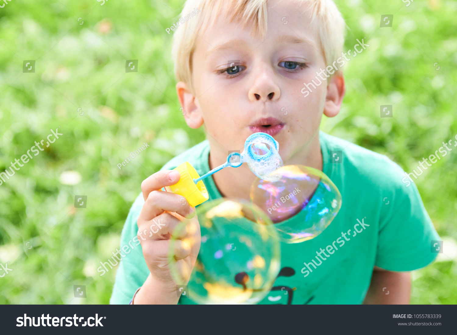 Young Boy Blowing Bubbles Greenery Background Stock Photo 1055783339 ...