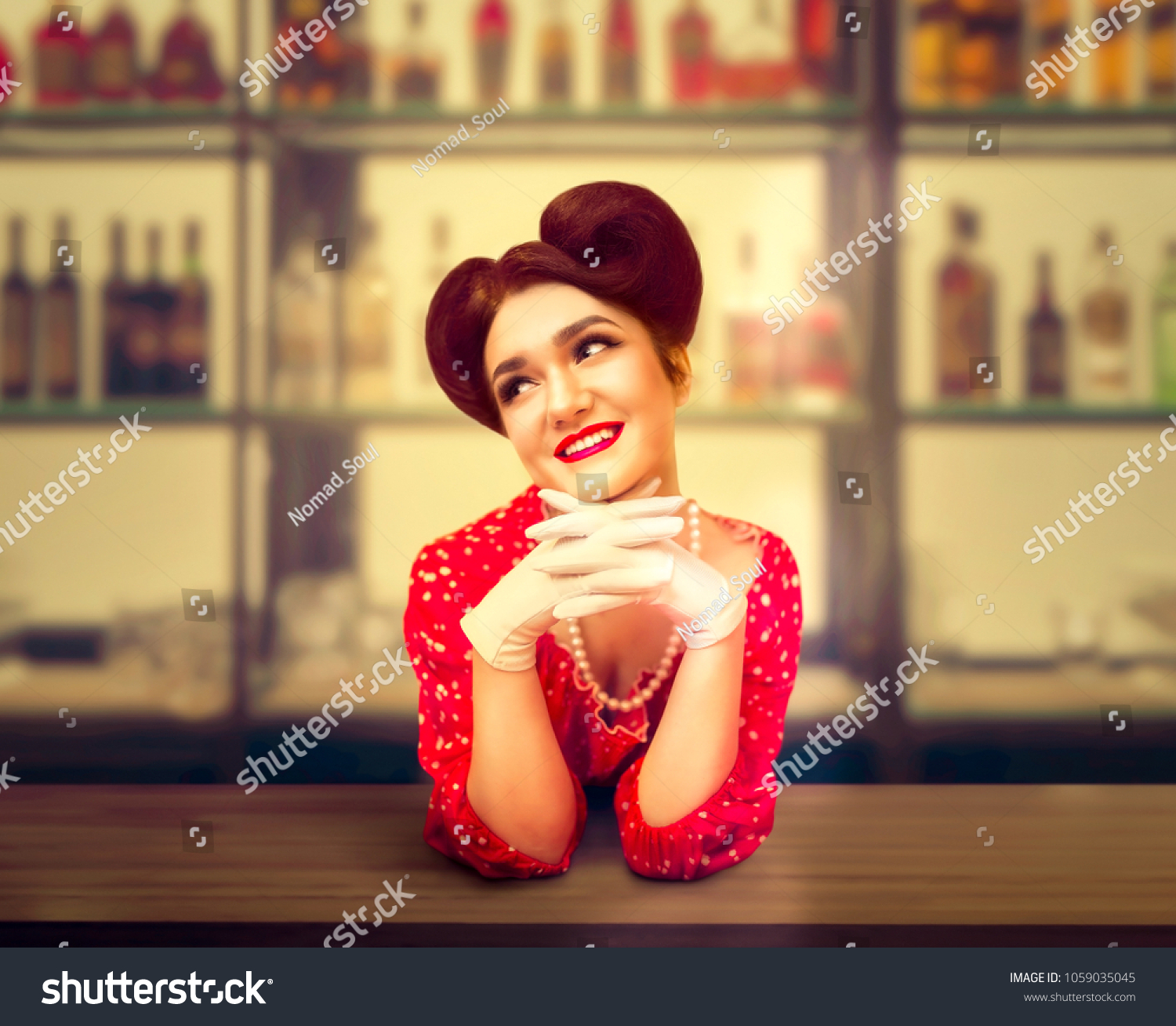 sexy-pin-girl-stands-behind-bar-1059035045-shutterstock