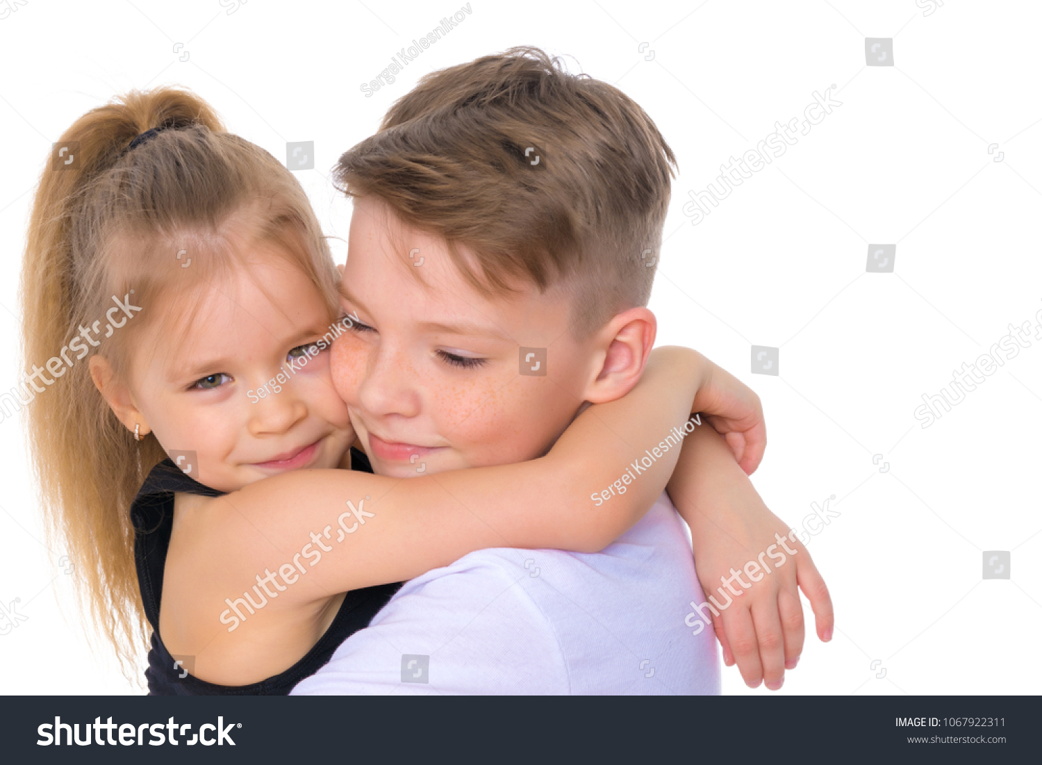 charming-little-girl-hugging-tall-boy-stock-photo-1067922311-shutterstock