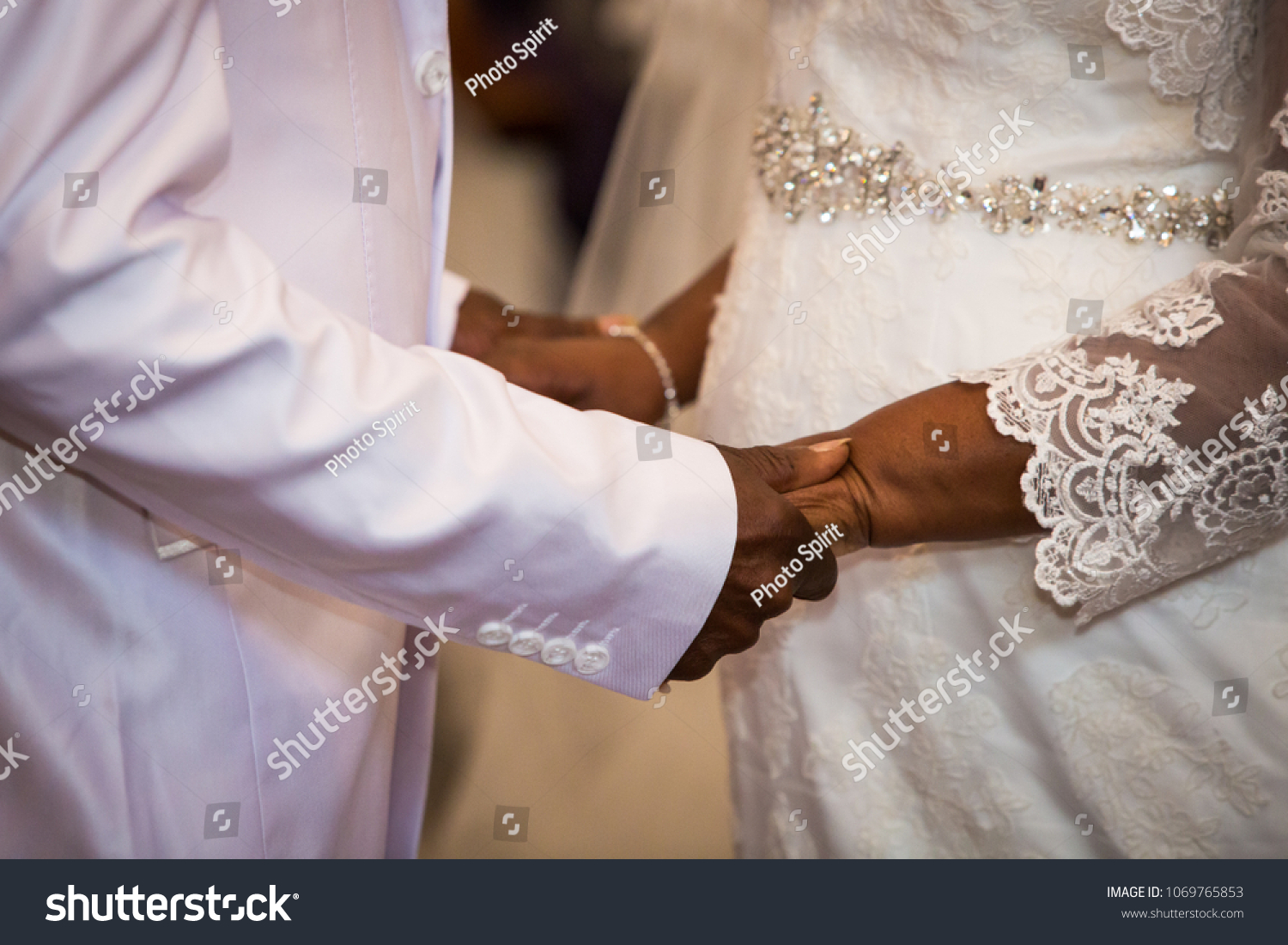 Black Couple Holding Hands During Marriage Stock Photo 1069765853   Stock Photo Black Couple Holding Hands During Marriage Ceremony 1069765853 