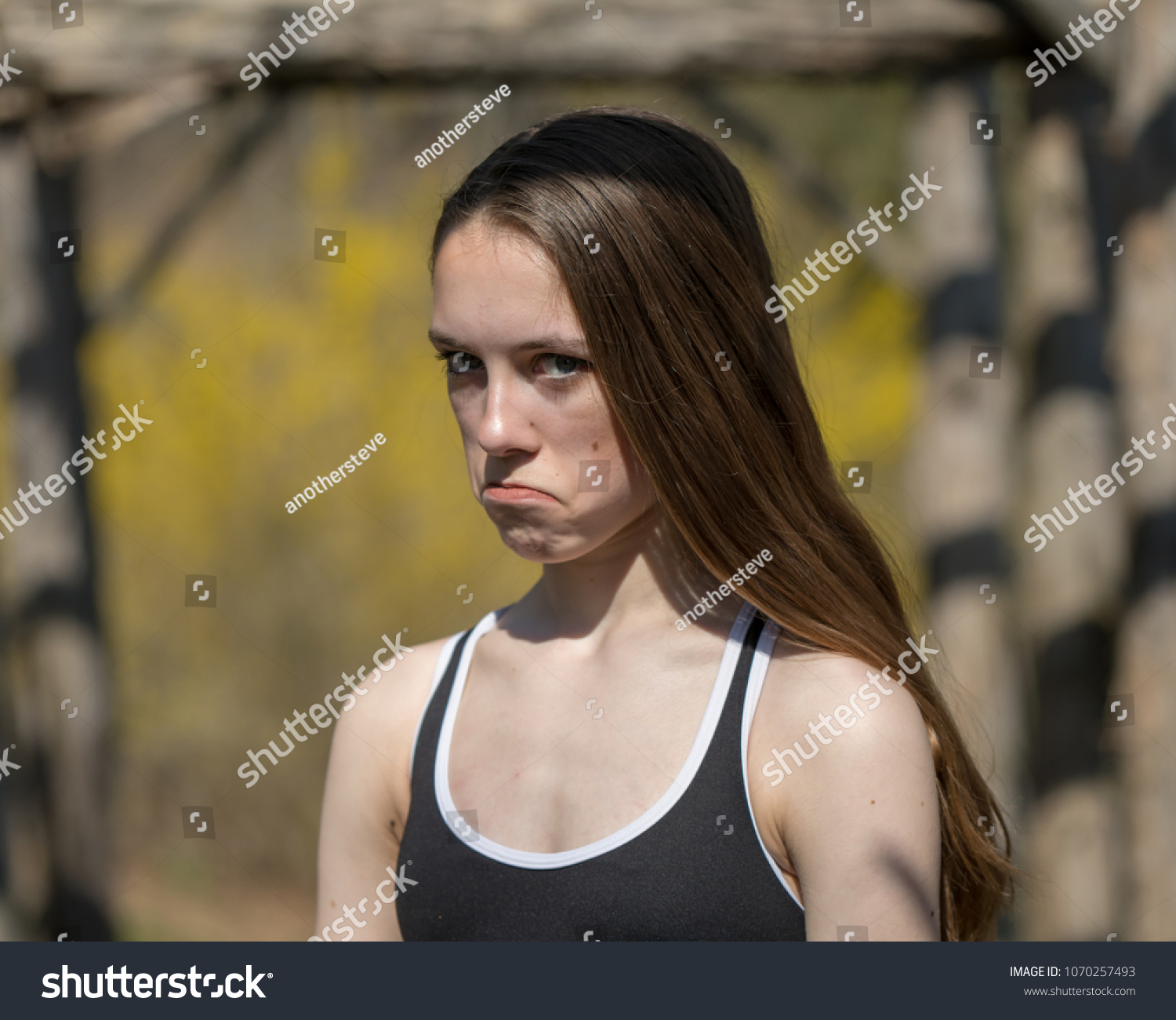 Teenage Girl Making Exaggerated Frown Face Stock Photo 1070257493 ...