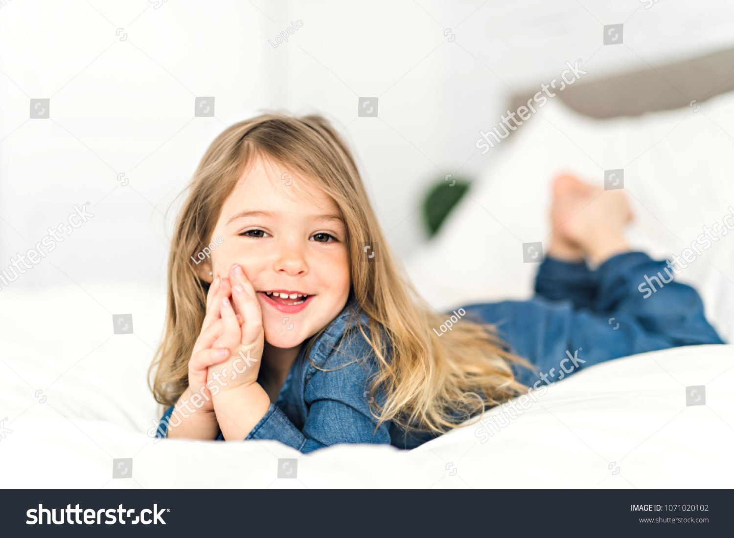 Beautiful Little Girl Lying On Bed Stock Photo 1071020102 | Shutterstock