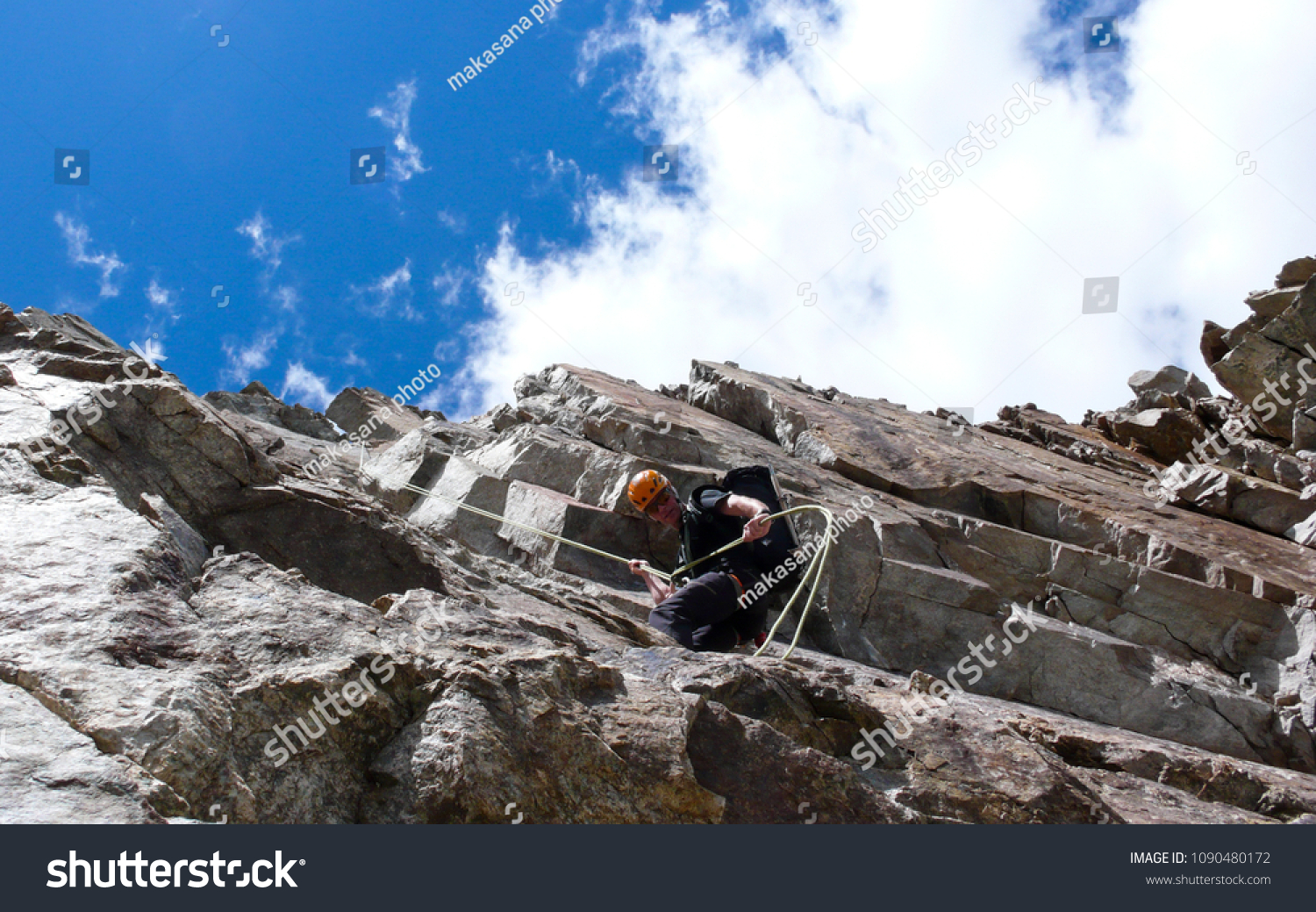 Male Mountain Guide Rappelling Off Steep Stock Photo 1090480172 