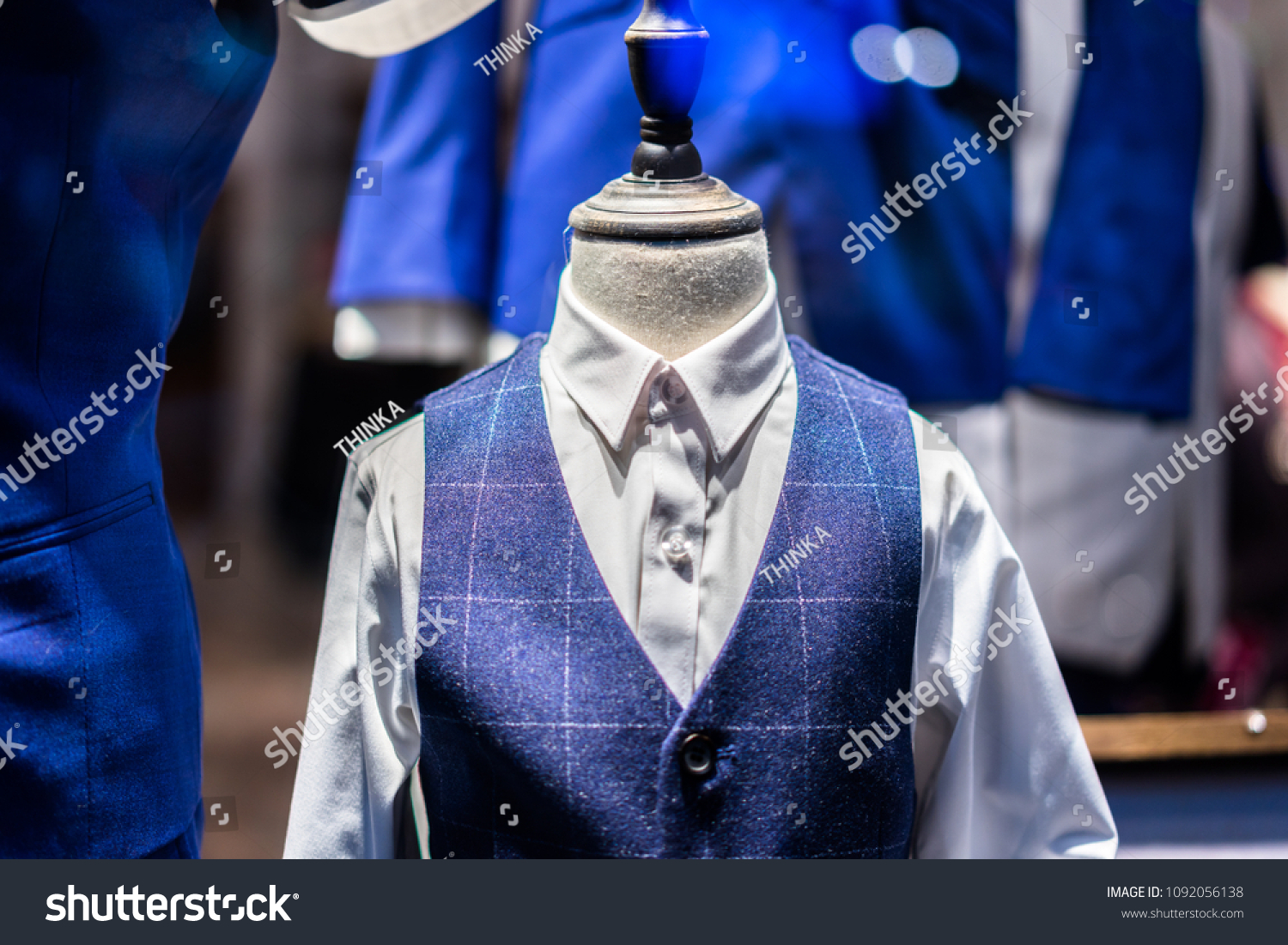 luxury-suit-shop-stock-photo-1092056138-shutterstock