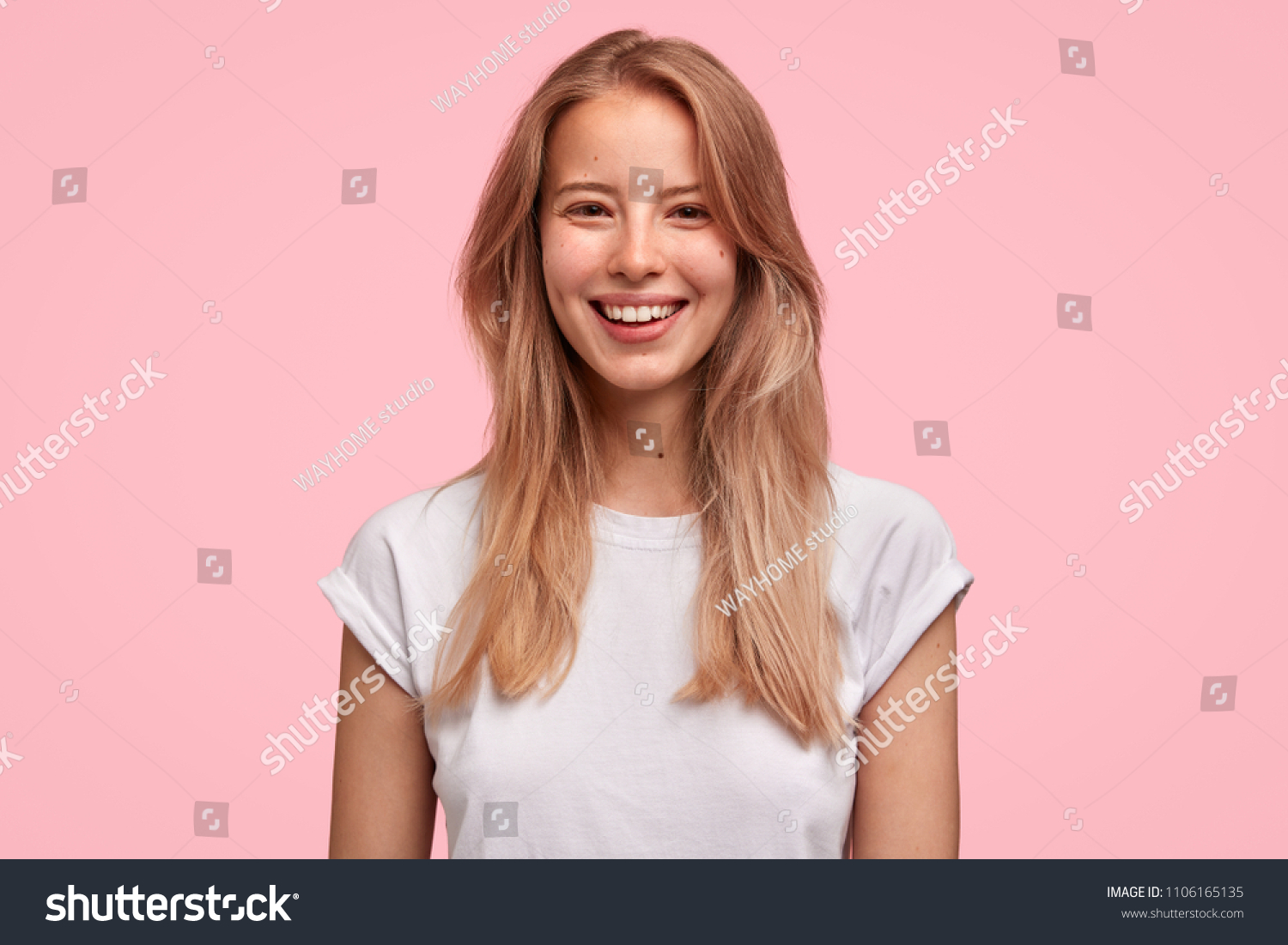 positive-young-female-pleasant-smile-has-stock-photo-1106165135