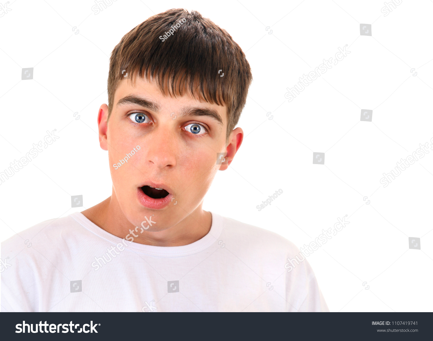 Surprised Young Man On White Background Stock Photo 1107419741