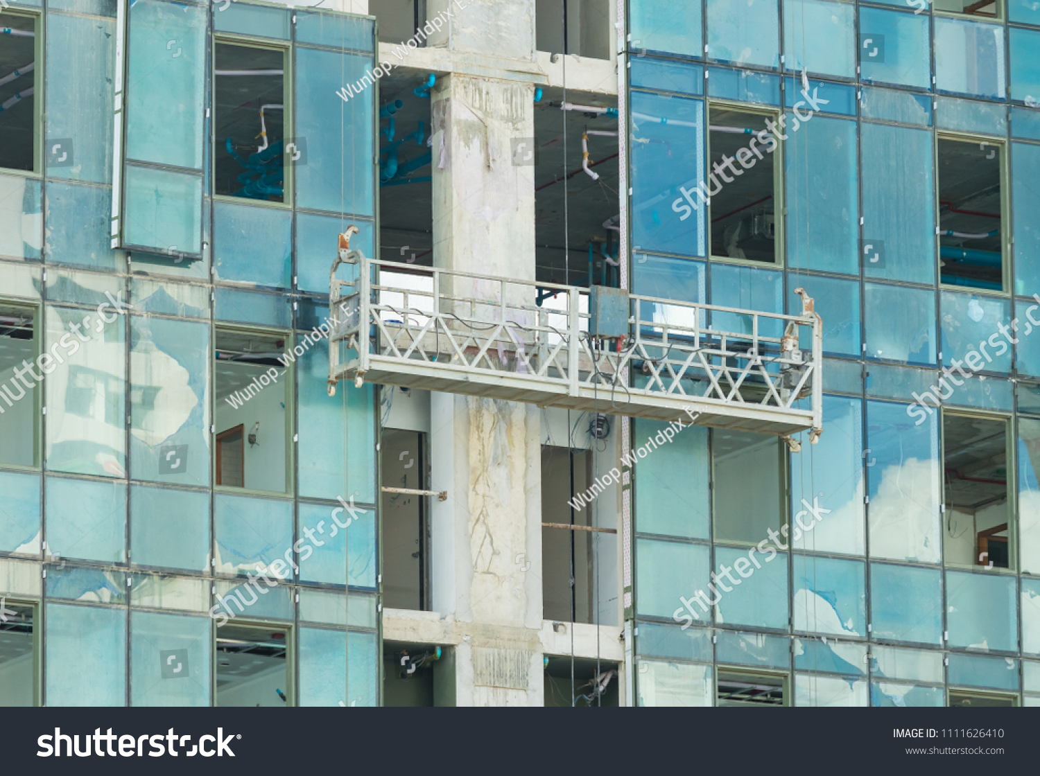 Scaffold Elevator Hanging On Building Under Stock Photo 1111626410