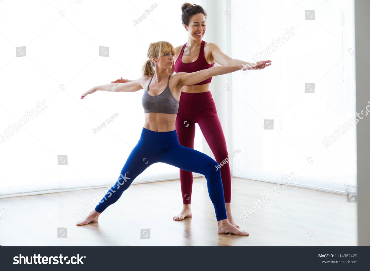 Shot Pretty Young Yoga Instructor Helping Stock Photo 1114382429 ...