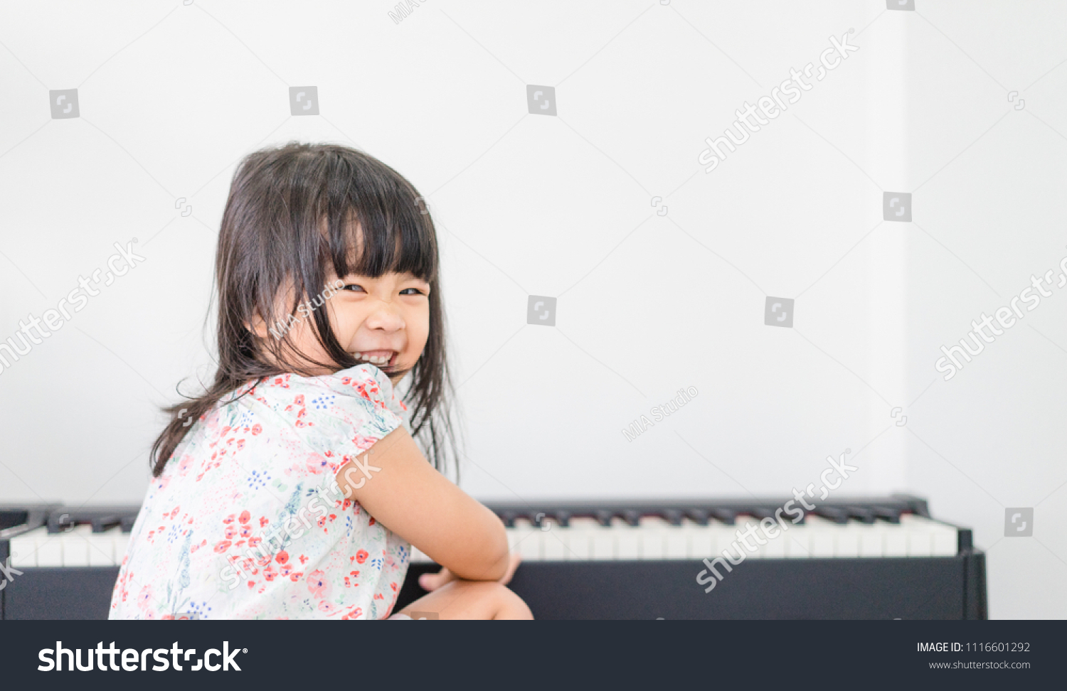 Beautiful Little Asian Girl Playing Piano Stock Photo 1116601292 ...