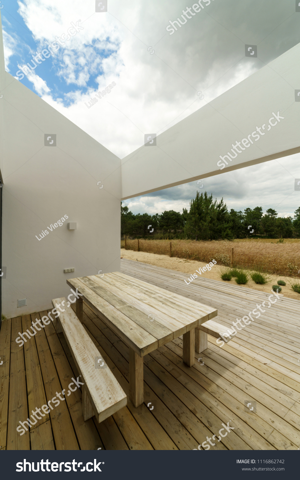 Stock Photo Modern House With Garden Swimming Pool And Wooden Deck 1116862742 
