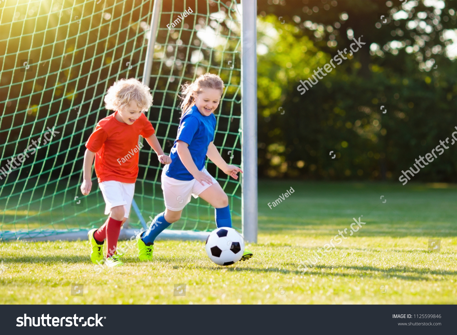 Kids Play Football On Outdoor Field Stock Photo 1125599846 | Shutterstock