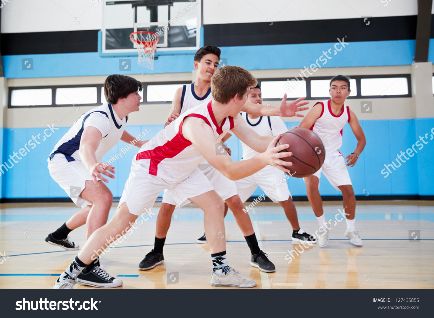 Male High School Basketball Team Dribbling Stock Photo 1127435855 ...