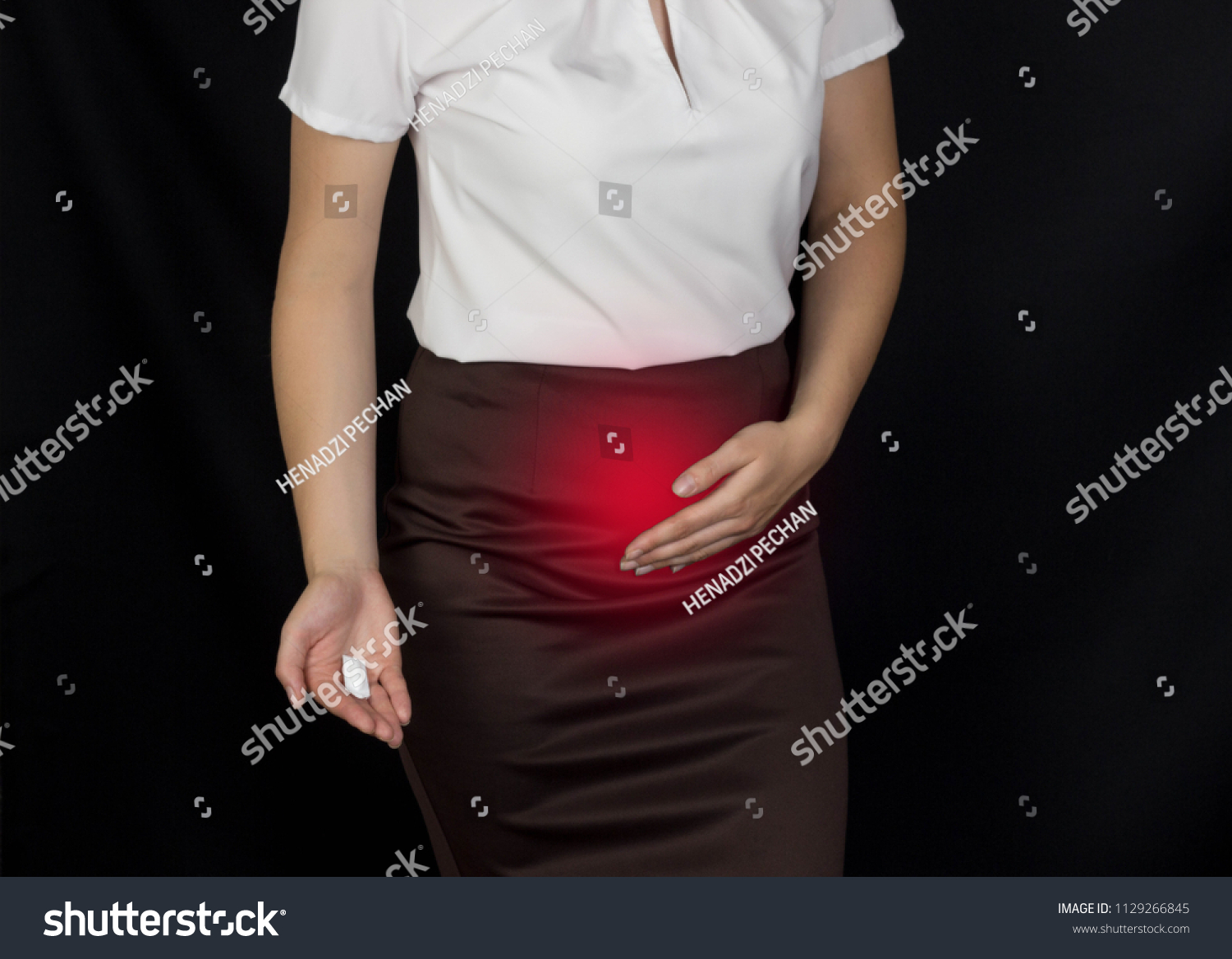 Stock Photo The Girl Holds On To The Lower Abdomen Smells And Holds In Her Hand Suppository Sexual Infection 1129266845 