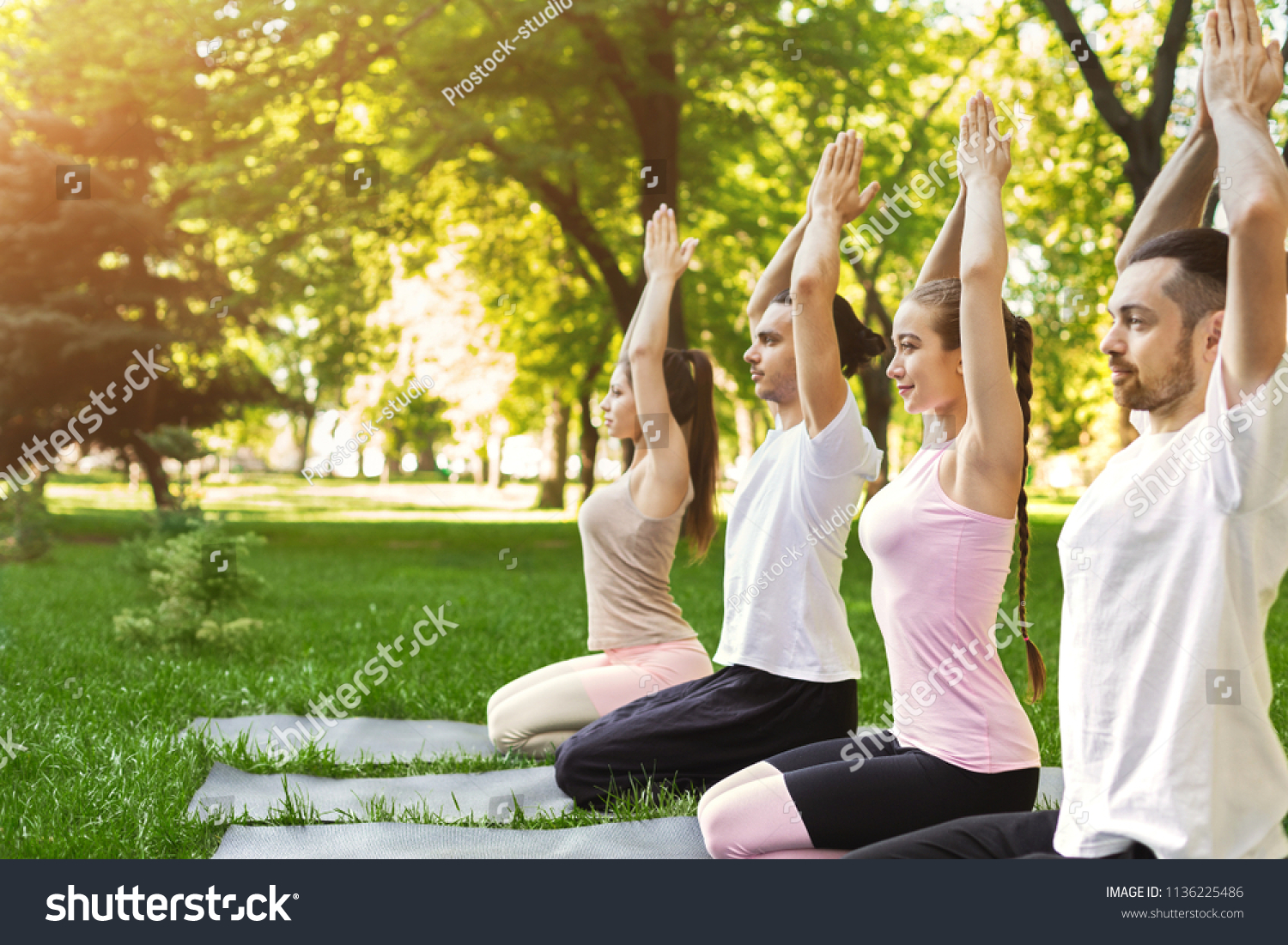 Practicing Yoga Together Group People Meditating Stock Photo 1136225486 ...