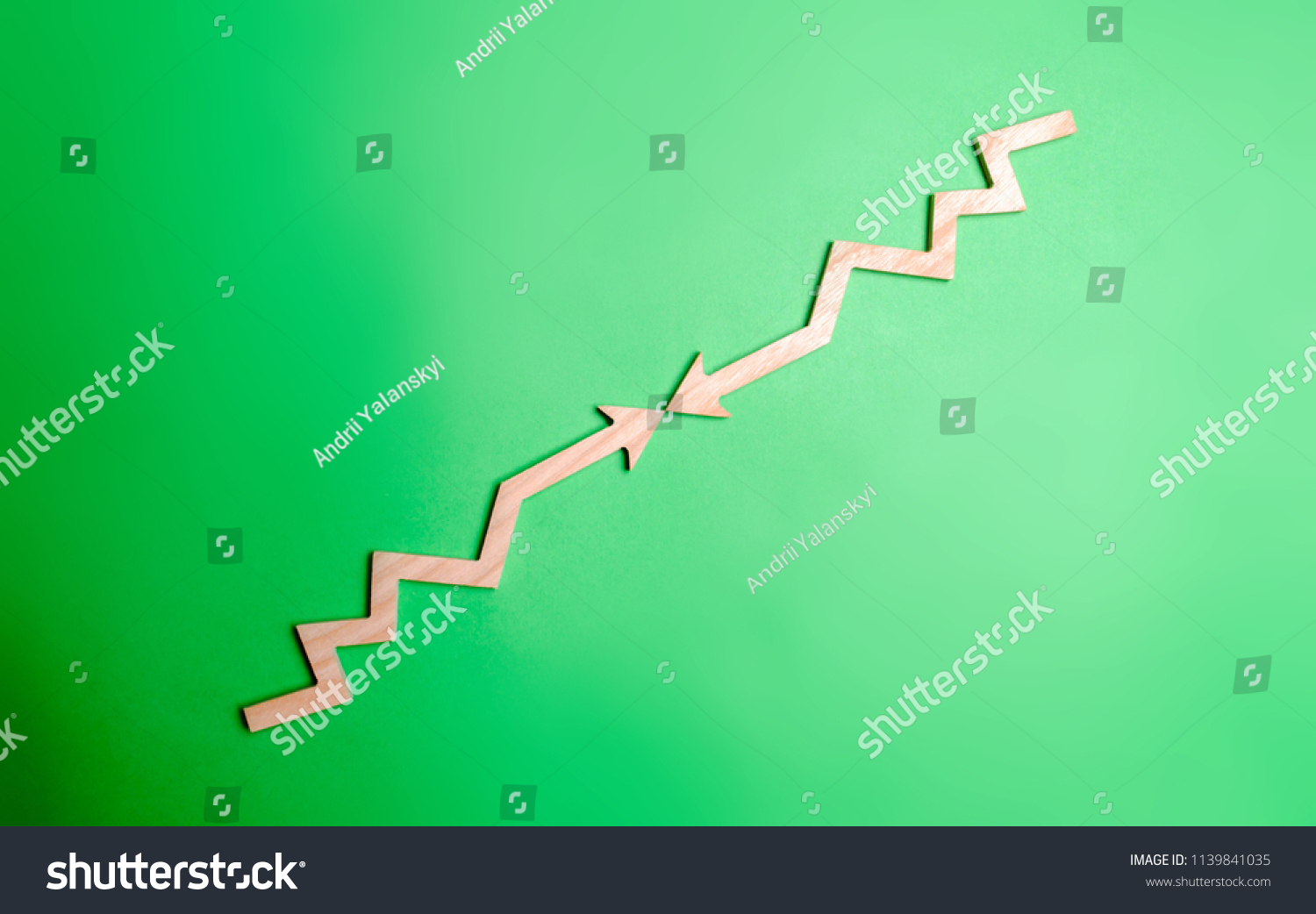 two-wooden-arrows-pointing-each-other-stock-photo-1139841035-shutterstock