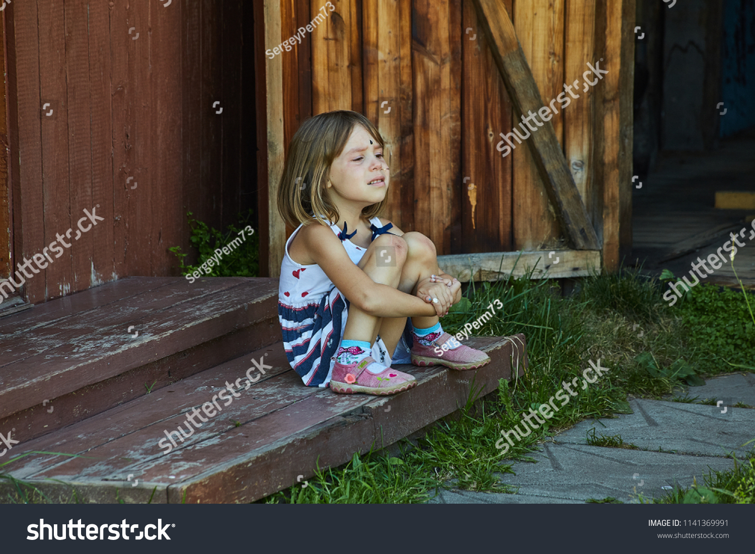 Frustrated Crying Child Sitting On Porch Stock Photo 1141369991 ...