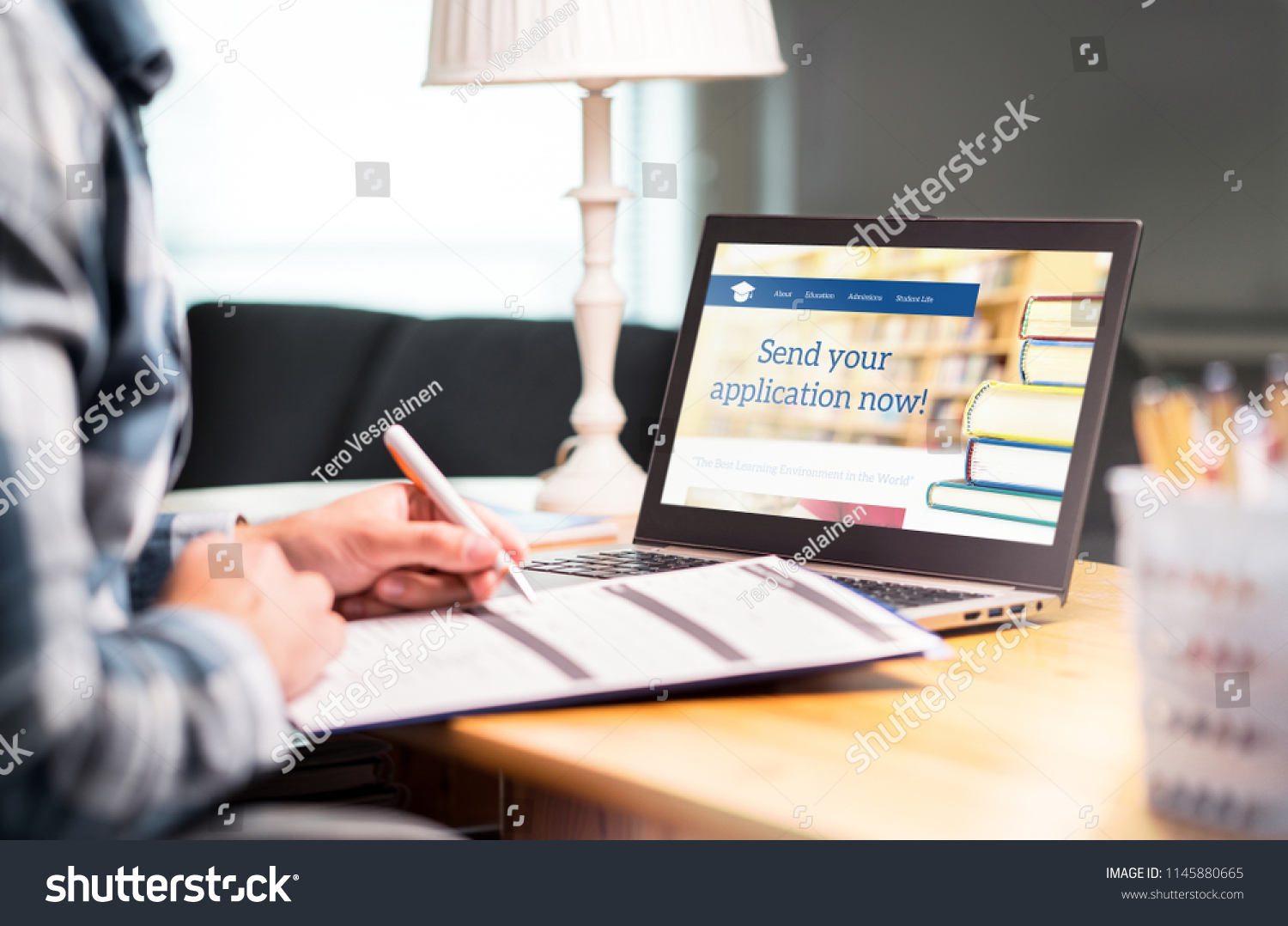 Young Man Writing College University Application Stock Photo 1145880665 ...