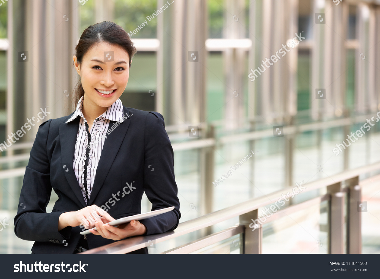 Chinese Businesswoman Working On Tablet Computer Stock Photo 114641500 Shut...
